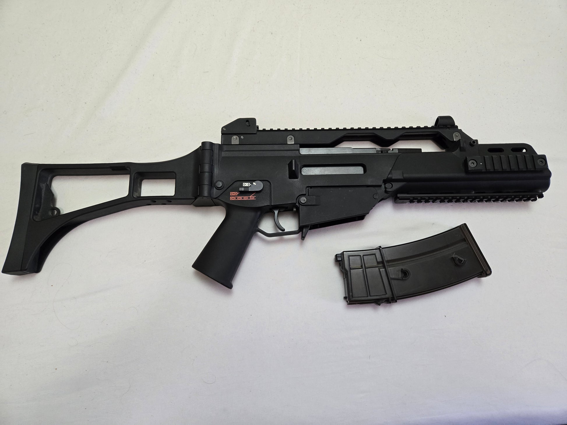 Black rifle with magazine on a white background